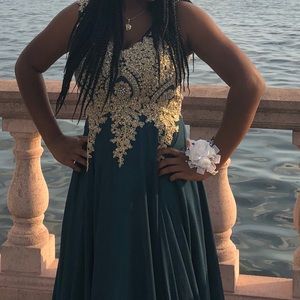 a gorgeous teal dress with gold embellishments